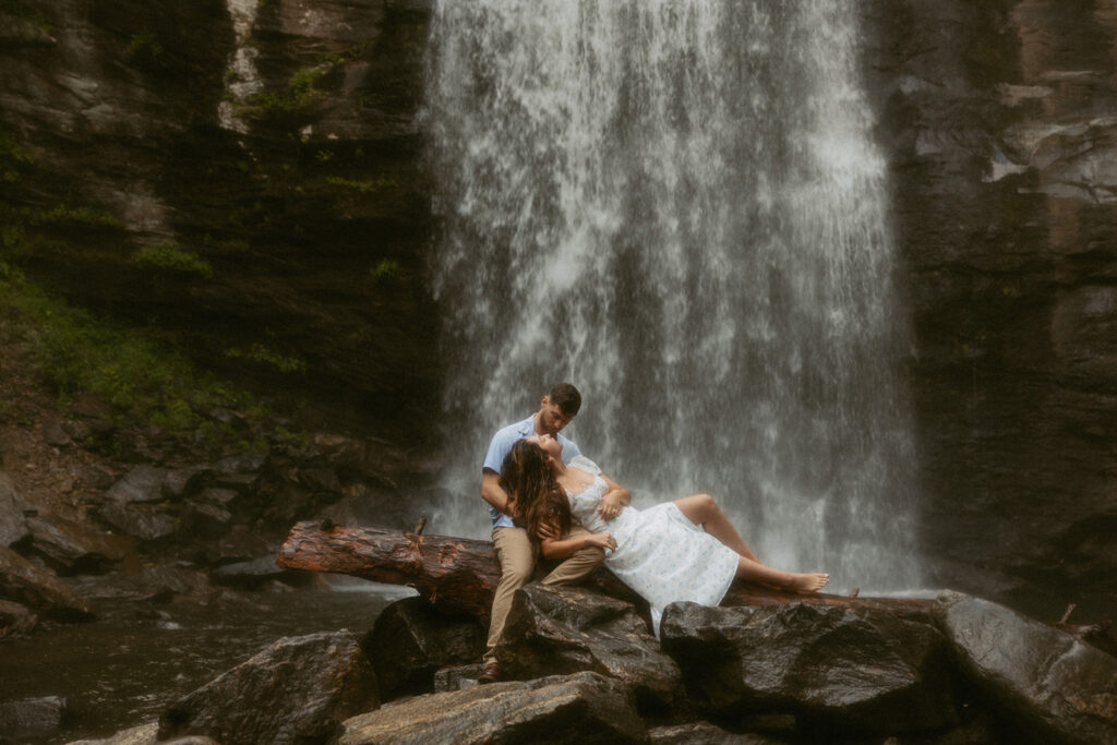 Man and woman in front of Looking Glass Falls.