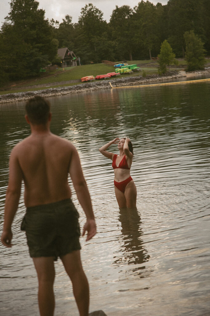 man watching woman swimming
