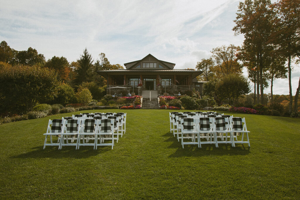 chairs set up at wedding ceremony with trillium links and lake club behind them