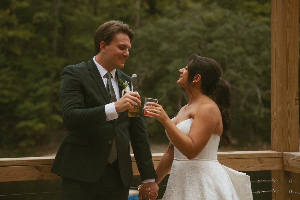 Husband and Wife cheersing on their wedding day.