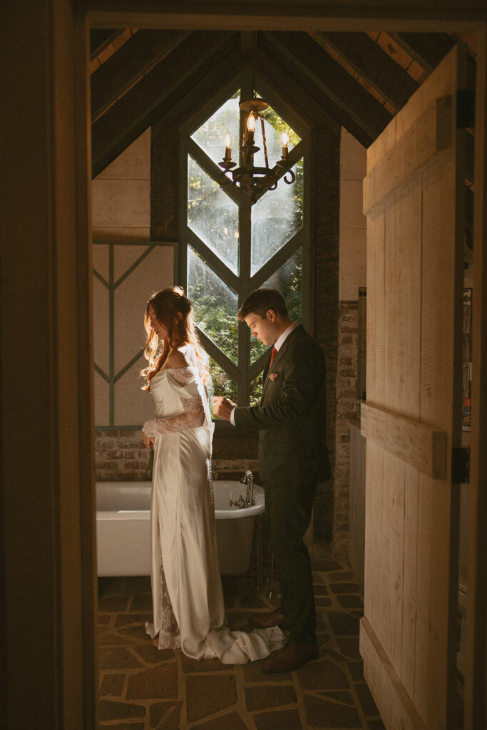 Bride and groom getting ready inside Douglas Ellington House with natural light