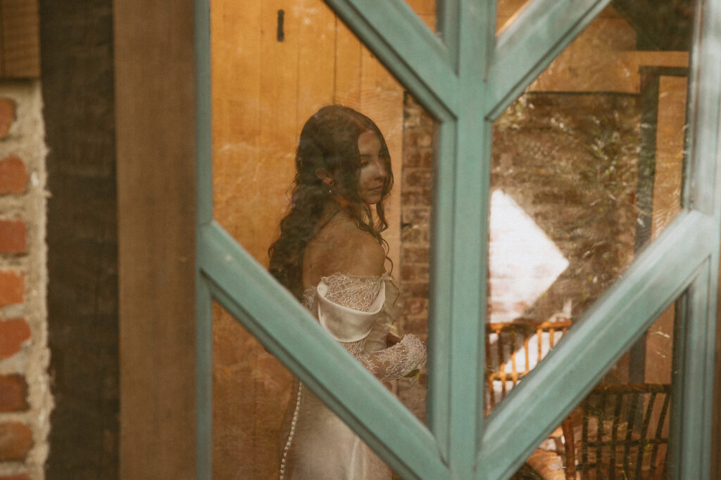 Bride getting ready inside Douglas Ellington House with natural light