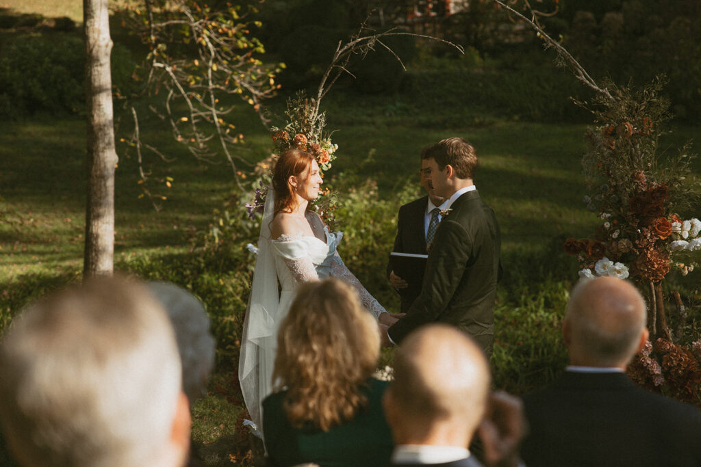 Intimate wedding ceremony in front of Douglas Ellington House