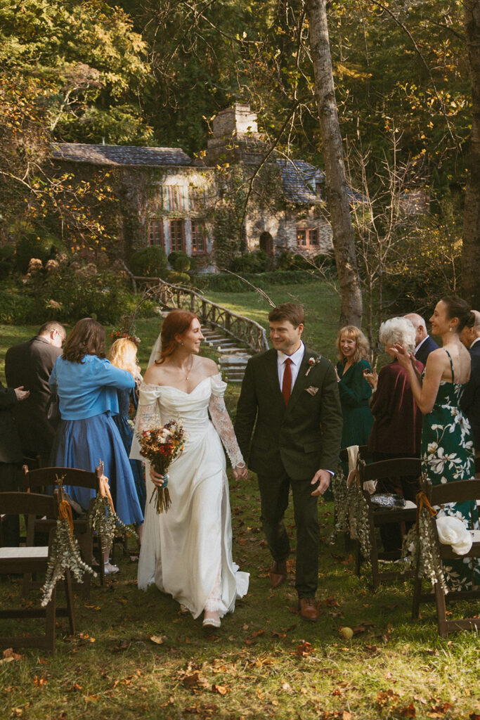 Couple walking back down the aisle after ceremony at Douglas Ellington House