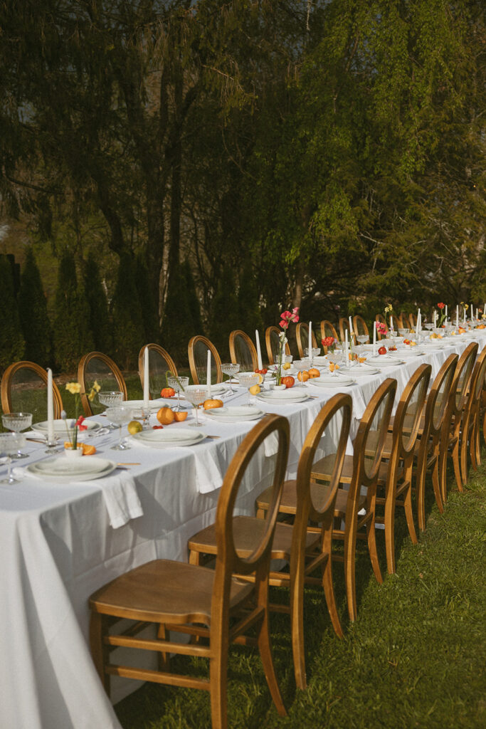 Dining tables arranged for a small wedding reception at Luxe Glass House.