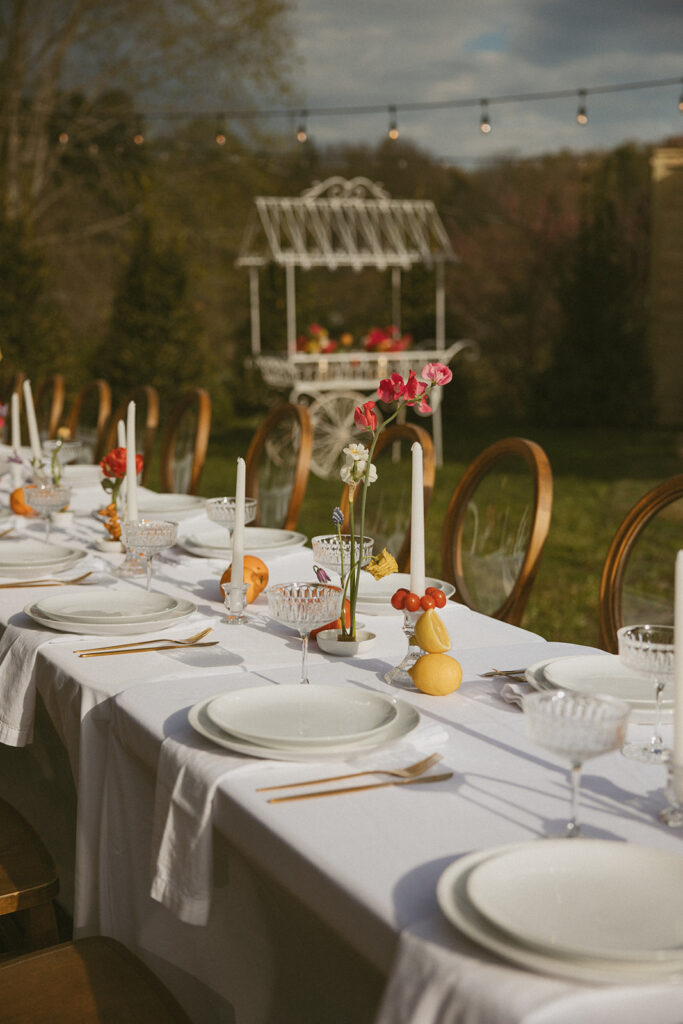 Dining tables arranged for a small wedding reception at Luxe Glass House.