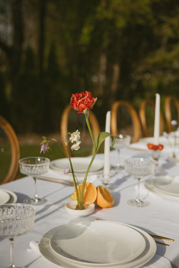 Dining tables arranged for a small wedding reception at Luxe Glass House.